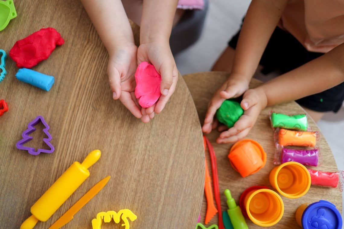 Children sculpt from plasticine, classes in a kids club, the concept of education and child development.