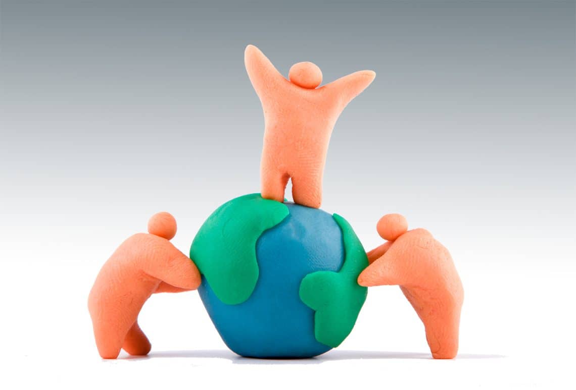 Plasticine of people embracing the earth